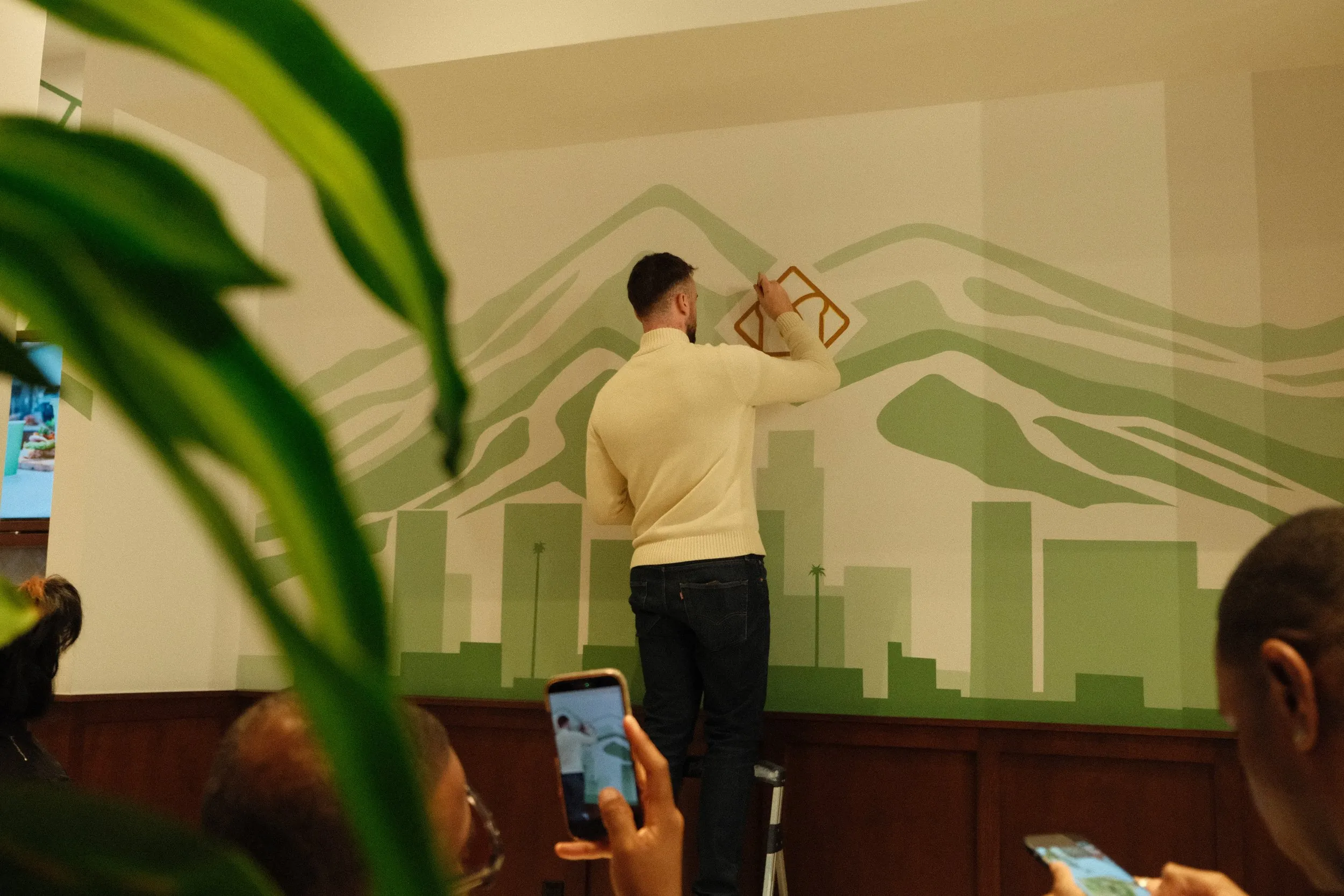 Branding mural painted inside Toastique for its grand opening in Downtown Los Angeles